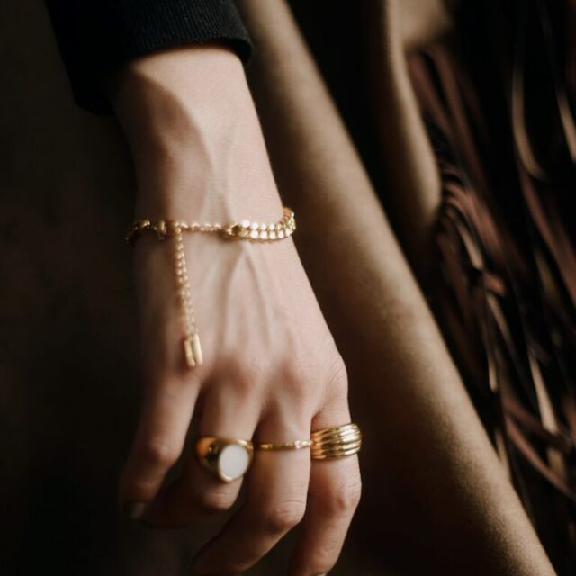 A bracelet and rings on a hand