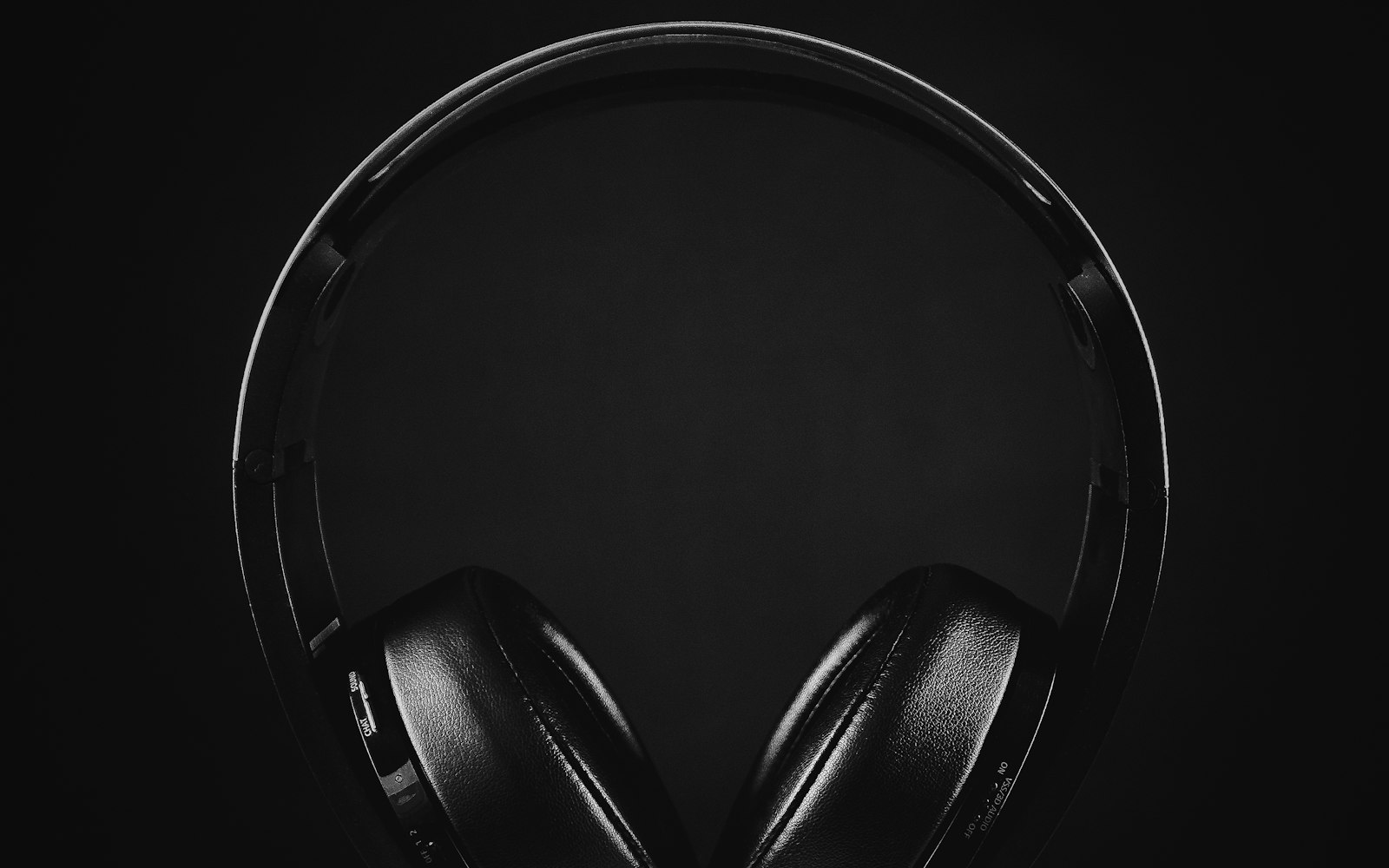 Black over-ear headphones on black