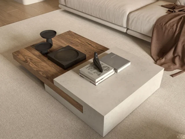 Elegant modern living room featuring a textured coffee table, cozy couch, and minimal decor.
