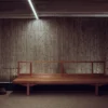 Elegant interior with a bamboo wall and a wooden bench, showcasing contemporary design.