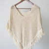 Fringed poncho in ivory